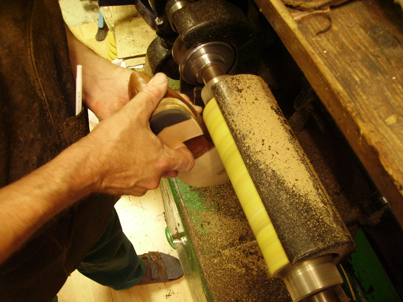This rotary finisher is then used to give the heel a smoother finish.